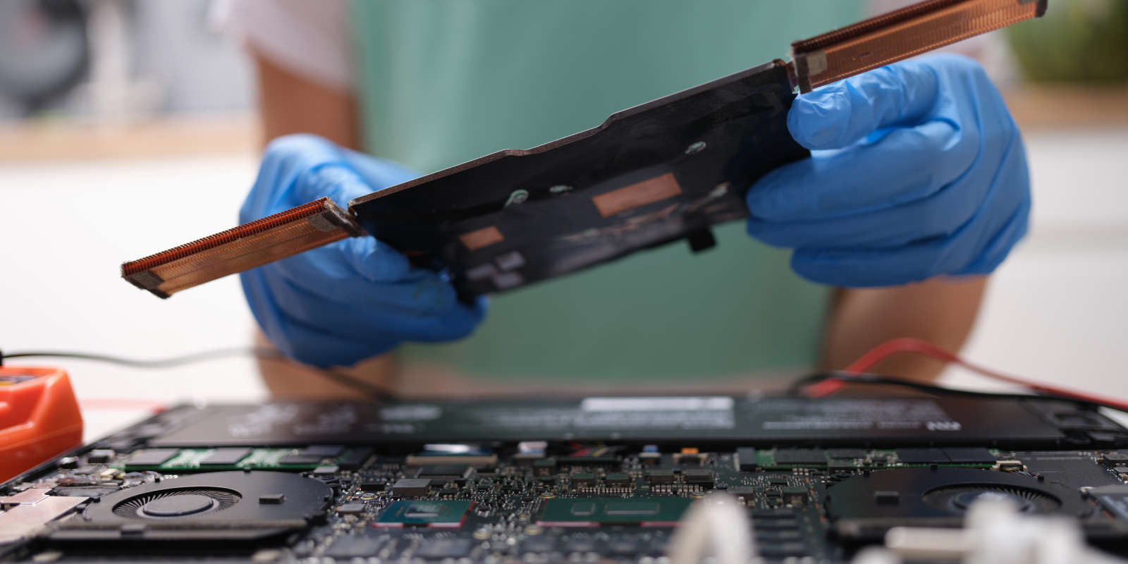 Person repairing or upgrading a laptop